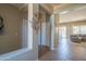 Bright hallway leading to various rooms, showcasing tiled flooring, tasteful decor, and ample natural light at 26072 N 74Th Ave, Peoria, AZ 85383