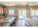 Bright, airy kitchen with an island and barstool seating leading to the outdoor covered patio at 26072 N 74Th Ave, Peoria, AZ 85383