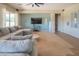 Inviting living room with modern decor, neutral-toned walls, and large windows, offering a comfortable space at 26072 N 74Th Ave, Peoria, AZ 85383