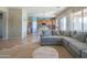 Open-concept living room and kitchen area with tile floors and natural lighting at 26072 N 74Th Ave, Peoria, AZ 85383