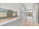 Open-concept living space with tile floors and large windows, offering natural light and a spacious feel at 26135 N Desert Mesa Dr, Surprise, AZ 85387