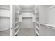 Spacious walk-in closet with ample shelving and hanging space at 26135 N Desert Mesa Dr, Surprise, AZ 85387