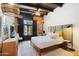 Comfortable bedroom showcases exposed wood beam ceiling and a large window with shutters at 3032 N 32Nd St # 61, Phoenix, AZ 85018