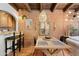 Dining area with brick wall, decorative lighting and seating at 3032 N 32Nd St # 61, Phoenix, AZ 85018