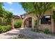 Charming front entrance with brick archway and well-maintained landscaping at 3032 N 32Nd St # 61, Phoenix, AZ 85018