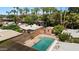 Aerial view of a beautiful backyard pool with brick surround and mature landscaping providing privacy at 3032 N 32Nd St # 61, Phoenix, AZ 85018