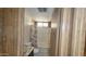 Bathroom featuring a shower/tub combo with floral shower curtain and modern toilet at 3104 E Broadway Rd # 268, Mesa, AZ 85204