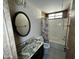 Bathroom with tub/shower combo, vanity with marble countertop, and an oval mirror at 3104 E Broadway Rd # 268, Mesa, AZ 85204