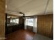 Bedroom featuring wood-look flooring, built-in cabinetry, and a ceiling fan at 3104 E Broadway Rd # 268, Mesa, AZ 85204