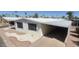 Manufactured home featuring covered parking and awning, enhanced by well-kept landscaping at 3104 E Broadway Rd # 268, Mesa, AZ 85204