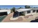 Manufactured home with covered parking and an awning, surrounded by well-maintained landscaping at 3104 E Broadway Rd # 268, Mesa, AZ 85204