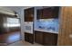 Kitchen boasting wooden cabinets, built in appliances, and an archway to another room at 3104 E Broadway Rd # 268, Mesa, AZ 85204
