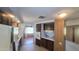 Well-lit kitchen features tile flooring, dark cabinetry, and an open floor plan at 3104 E Broadway Rd # 268, Mesa, AZ 85204