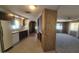 Galley kitchen design featuring dark wood cabinets, and tile flooring, with appliances at 3104 E Broadway Rd # 268, Mesa, AZ 85204