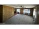 Spacious living room displaying wall paneling, large windows, and ceiling fans at 3104 E Broadway Rd # 268, Mesa, AZ 85204