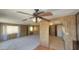 Open-concept living room showcasing two ceiling fans and tile flooring at 3104 E Broadway Rd # 268, Mesa, AZ 85204