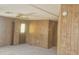 Neutral living room with carpet flooring and door to the exterior at 3104 E Broadway Rd # 268, Mesa, AZ 85204