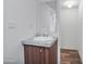 Bathroom featuring sink, mirror, wood floors, and minimalist decor at 320 E Mckellips Rd # 25, Mesa, AZ 85201