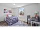 Cozy bedroom featuring stylish floral bedding, work desk, and soft gray area rug at 320 E Mckellips Rd # 25, Mesa, AZ 85201