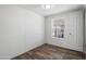 Bright bedroom with neutral colors, laminate flooring, and a large window at 320 E Mckellips Rd # 25, Mesa, AZ 85201