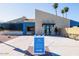 Exterior of Palm Harbor Estates sales center, featuring modern architecture and a clear directional sign at 320 E Mckellips Rd # 25, Mesa, AZ 85201