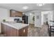 Well-lit kitchen with a stainless steel sink, granite countertops, and modern appliances at 320 E Mckellips Rd # 25, Mesa, AZ 85201
