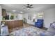 Bright living room with wood floors, neutral walls, stylish furnishings, and modern ceiling fan at 320 E Mckellips Rd # 25, Mesa, AZ 85201