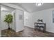 Bright living room with wood floors, minimalist decor, and a view of the front door at 320 E Mckellips Rd # 25, Mesa, AZ 85201
