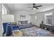 Well-lit living room with neutral decor, sofa, chair, and accent rug at 320 E Mckellips Rd # 25, Mesa, AZ 85201