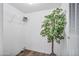 Bright walk-in closet with wood floor, wire shelving, and a modern decorative tree at 320 E Mckellips Rd # 25, Mesa, AZ 85201