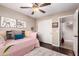 Bedroom features a daybed, ceiling fan, closet, and view of a doorway at 3535 E Brookwood Ct, Phoenix, AZ 85048
