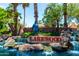Lakewood entrance with flowing water, palm trees, and a decorative statue at 3535 E Brookwood Ct, Phoenix, AZ 85048