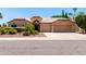 Charming single-story home with well-manicured landscaping and a two-car garage at 3535 E Brookwood Ct, Phoenix, AZ 85048