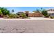 Inviting single-story home with a lush front yard and a spacious driveway at 3535 E Brookwood Ct, Phoenix, AZ 85048