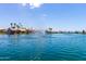 Waterfront view with a fountain feature in the center of the lake at 3535 E Brookwood Ct, Phoenix, AZ 85048