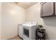 Laundry room features new appliances and gray storage cabinets at 3535 E Brookwood Ct, Phoenix, AZ 85048