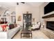 Comfortable living room with a fireplace, a stylish bookcase, and modern decor at 3535 E Brookwood Ct, Phoenix, AZ 85048