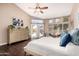 Bright main bedroom features vaulted ceiling, ensuite, access to patio, and wood look flooring at 3535 E Brookwood Ct, Phoenix, AZ 85048