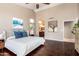 Bright main bedroom features vaulted ceiling, modern decor, and wood look flooring at 3535 E Brookwood Ct, Phoenix, AZ 85048