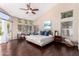 Bright main bedroom features vaulted ceiling, ceiling fan, ensuite, and access to patio at 3535 E Brookwood Ct, Phoenix, AZ 85048
