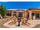 Staged patio featuring Adirondack chairs, patio table, and a built in grill at 3535 E Brookwood Ct, Phoenix, AZ 85048