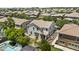 Aerial view of home features mature trees, pool, putting green, and desert landscaping at 3575 E Gary Way, Gilbert, AZ 85234