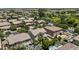 Aerial view of house in a neighborhood with pools and lush landscaping at 3575 E Gary Way, Gilbert, AZ 85234