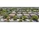 Charming neighborhood aerial view with mature trees, well-maintained houses, and a community church at 3575 E Gary Way, Gilbert, AZ 85234