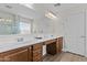 Bathroom features a double sink vanity, a large mirror, and a glass-enclosed shower at 3575 E Gary Way, Gilbert, AZ 85234