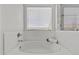 Bright bathroom showcasing a soaking tub and a large window at 3575 E Gary Way, Gilbert, AZ 85234