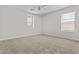Neutral bedroom with carpet, two windows, and neutral walls at 3575 E Gary Way, Gilbert, AZ 85234