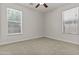 This is a bedroom featuring neutral carpet, and natural light from two bright windows at 3575 E Gary Way, Gilbert, AZ 85234