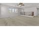 This is a bright, neutral bonus room with neutral carpet and wooden railing at 3575 E Gary Way, Gilbert, AZ 85234
