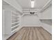 Walk-in closet features shelving, a hanging rack, and neutral walls at 3575 E Gary Way, Gilbert, AZ 85234